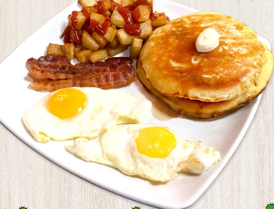 Canadian breakfast combo with pancakes and eggs at Fiesta